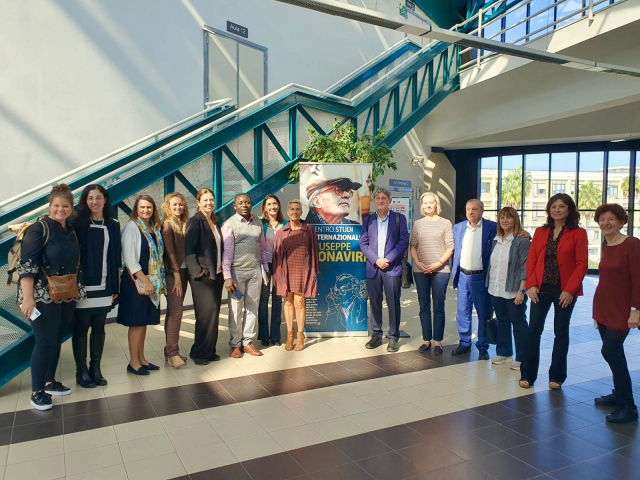 Group photograph with President Giuseppina Bonaviri at the center